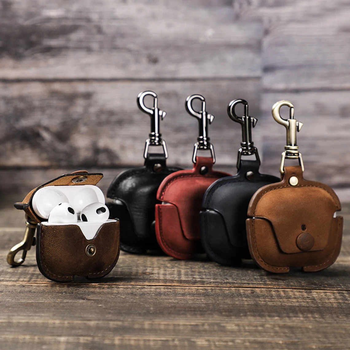 Elevate the safety and style of your AirPod Pro and AirPod 3 with our Genuine Leather Cases. These cases are like cozy homes for your AirPods, crafted from real, high-quality leather that's both strong and super good-looking. They fit your AirPods just right, protecting them from little bumps and scratches while showing off a classic charm. With their soft feel, the leather gets even cooler as time passes, sort of like a special memory book.
