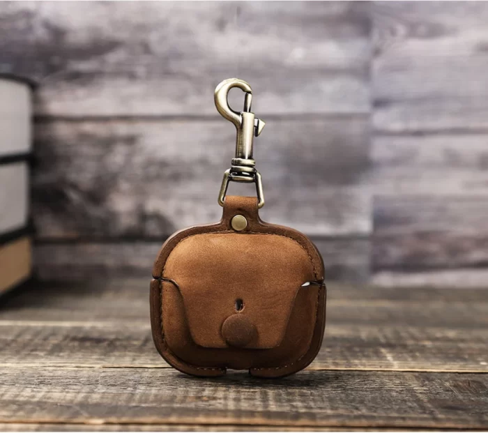 Elevate the safety and style of your AirPod Pro and AirPod 3 with our Genuine Leather Cases. These cases are like cozy homes for your AirPods, crafted from real, high-quality leather that's both strong and super good-looking. They fit your AirPods just right, protecting them from little bumps and scratches while showing off a classic charm. With their soft feel, the leather gets even cooler as time passes, sort of like a special memory book.